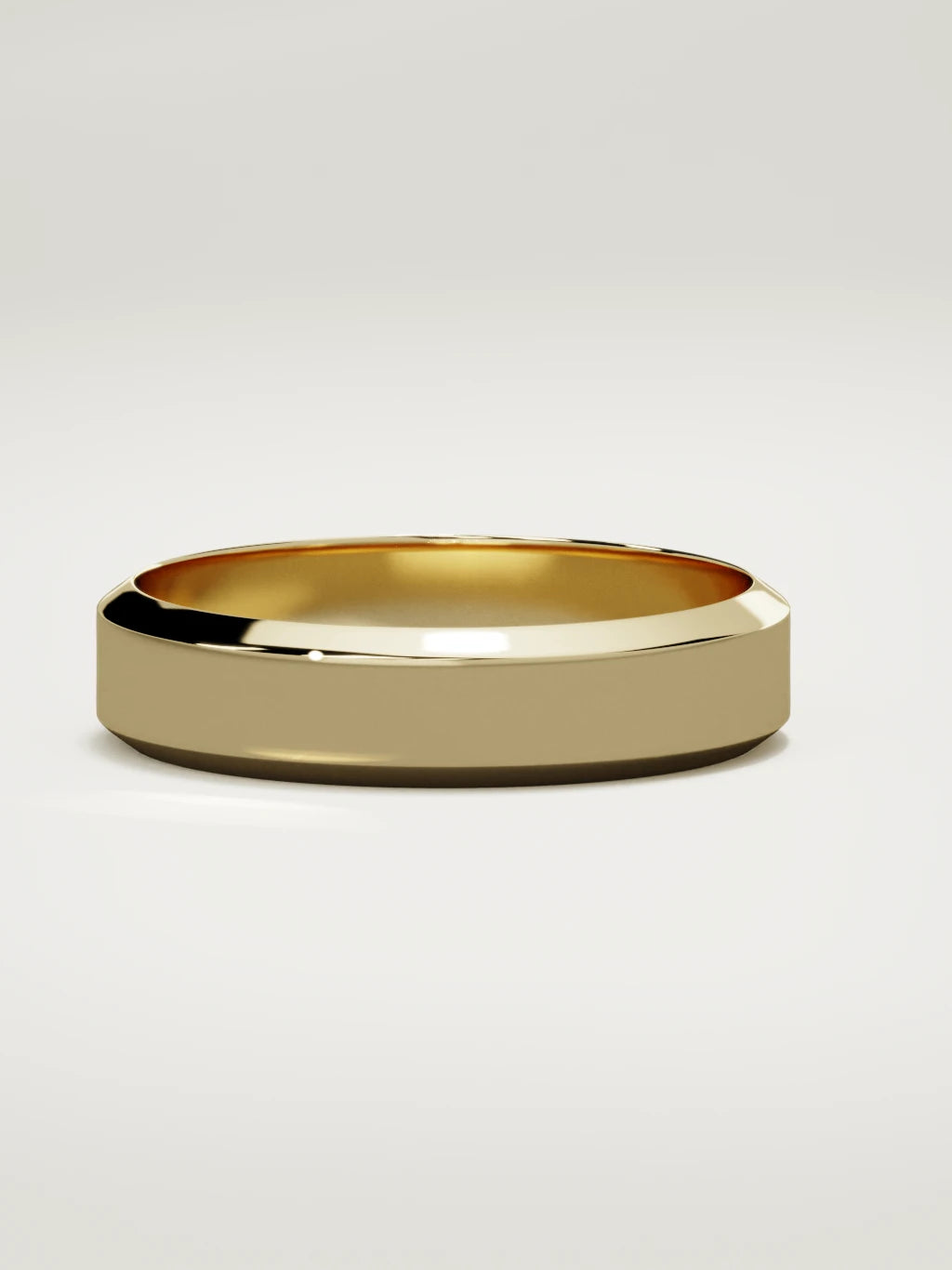 The Canto chamfered-edge men's wedding band in 14K yellow gold, 5 mm, three-quarter view