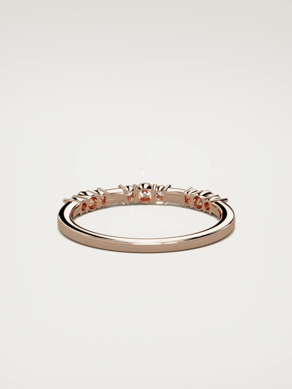 The Cielo scattered diamond band in 14K rose gold, back view