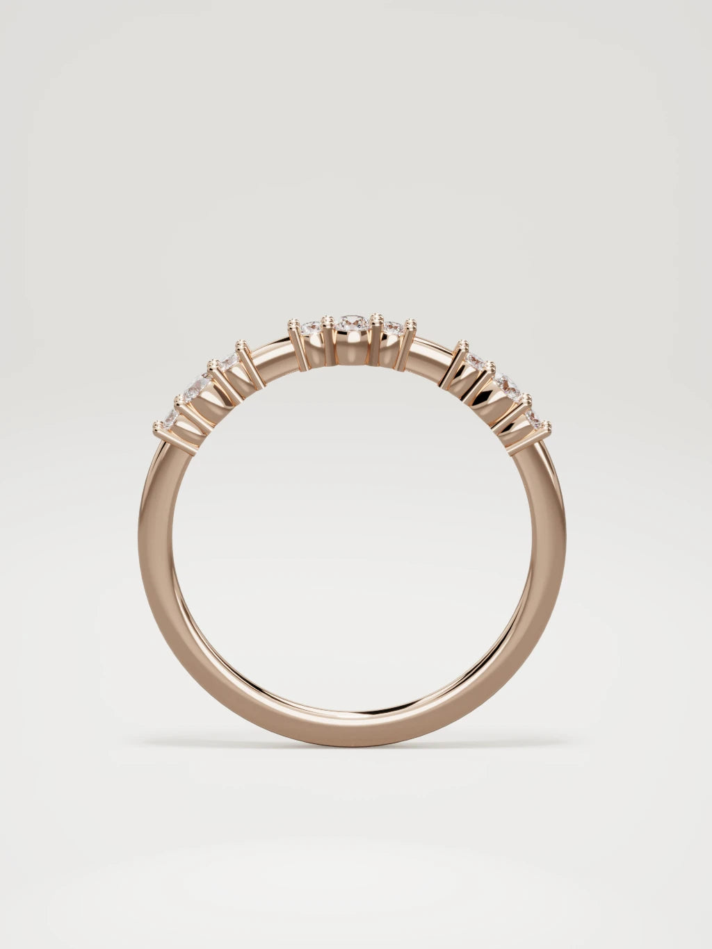The Cielo scattered diamond band in 14K rose gold, standing front view