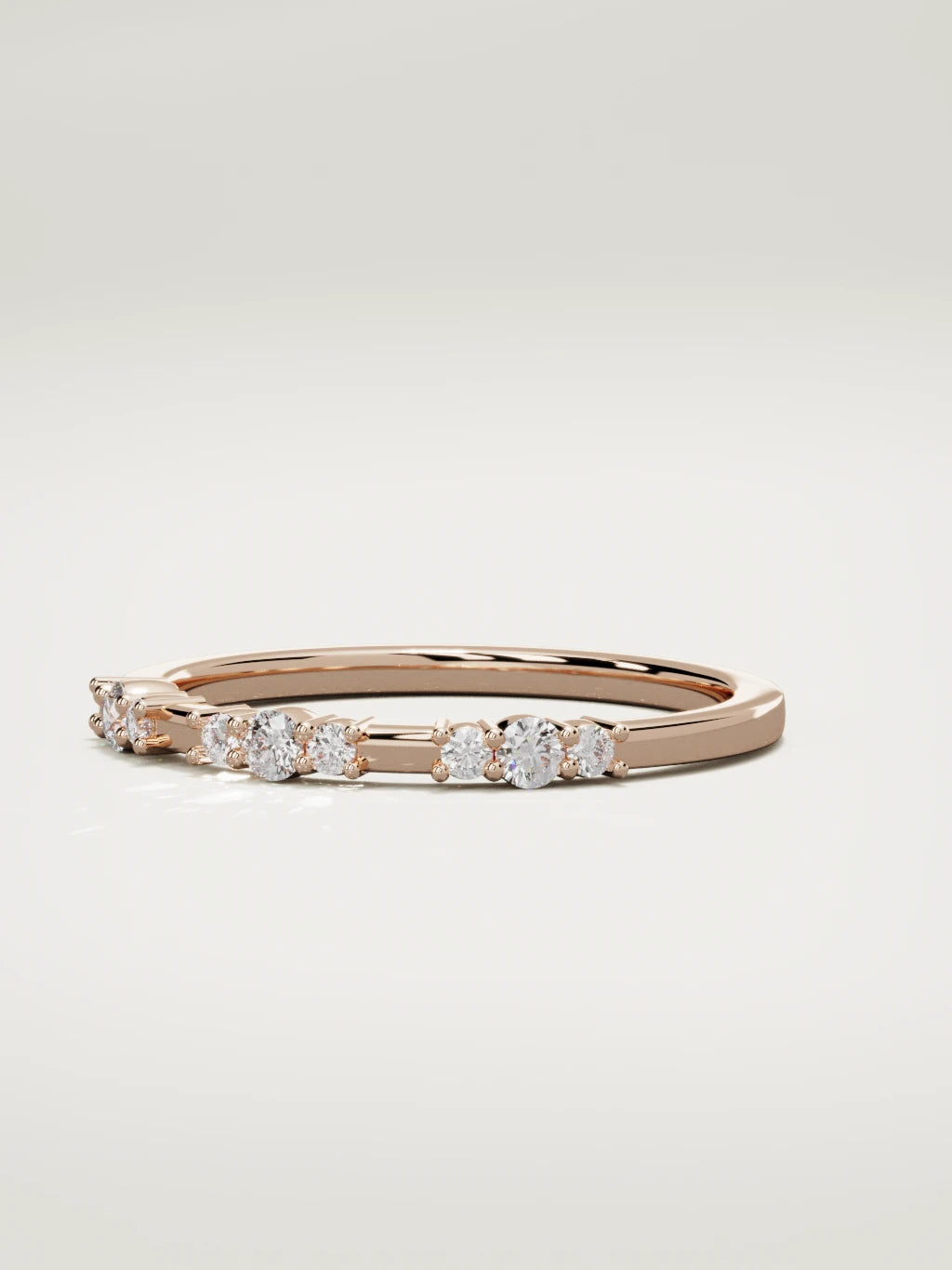 The Cielo scattered diamond band in 14K rose gold, three-quarter view