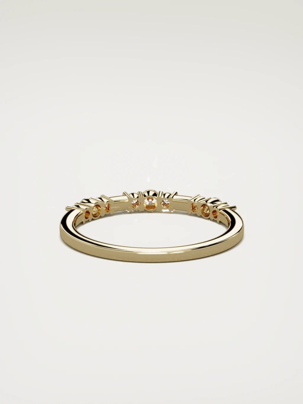 The Cielo scattered diamond band in 14K yellow gold, back view