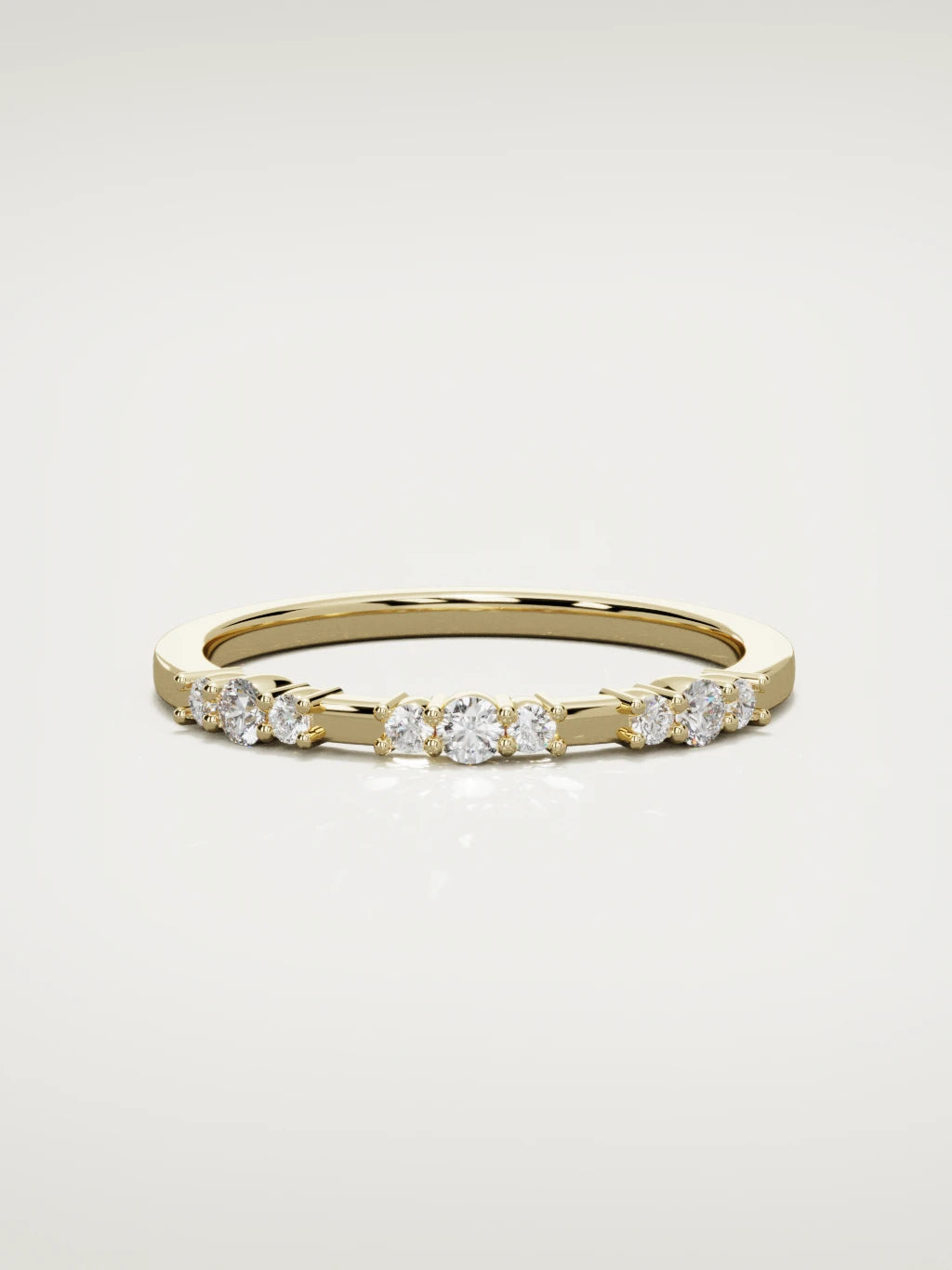 The Cielo scattered diamond band in 14K yellow gold, front view