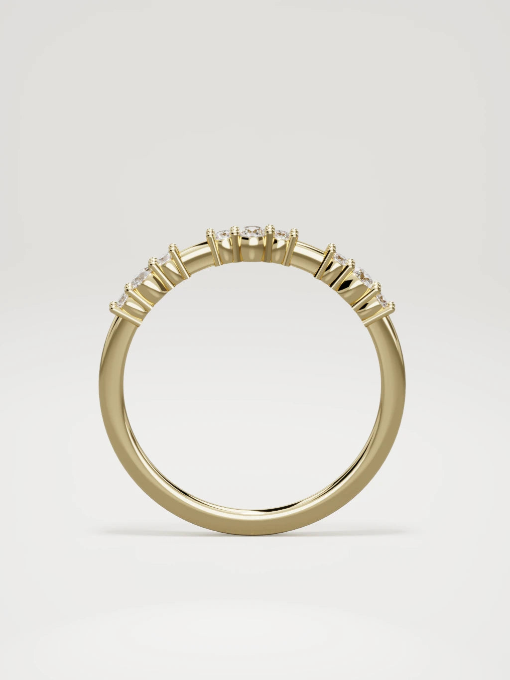 The Cielo scattered diamond band in 14K yellow gold, standing front view