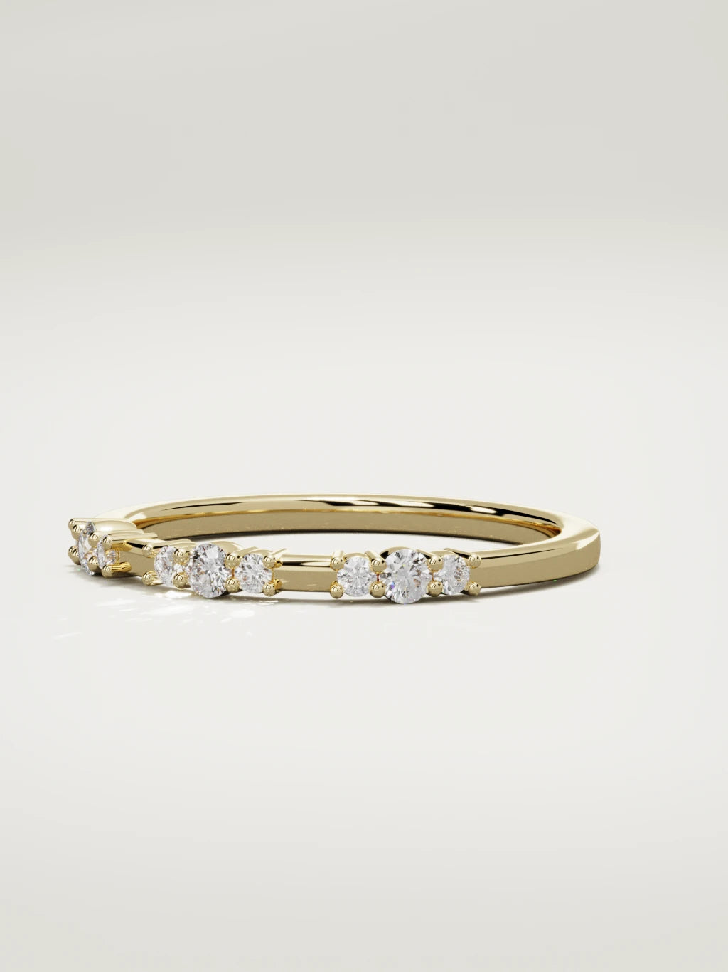 The Cielo scattered diamond band in 14K yellow gold, three-quarter view