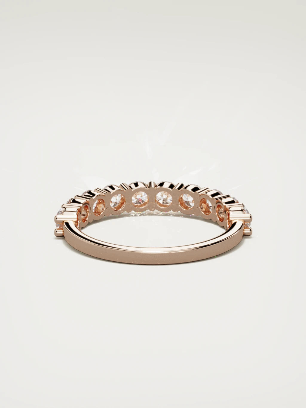 The Clara shared-prong half eternity band in 14K rose gold, back view