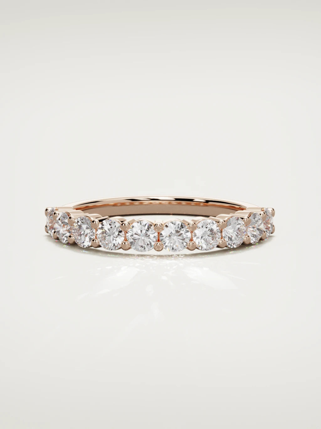 The Clara shared-prong half eternity band in 14K rose gold, front view