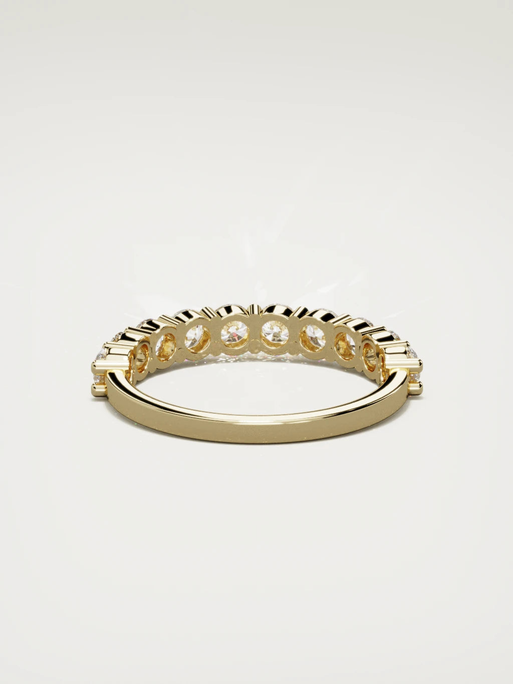 The Clara shared-prong half eternity band in 14K yellow gold, back view