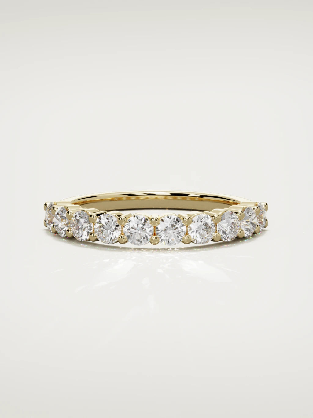 The Clara shared-prong half eternity band in 14K yellow gold, front view