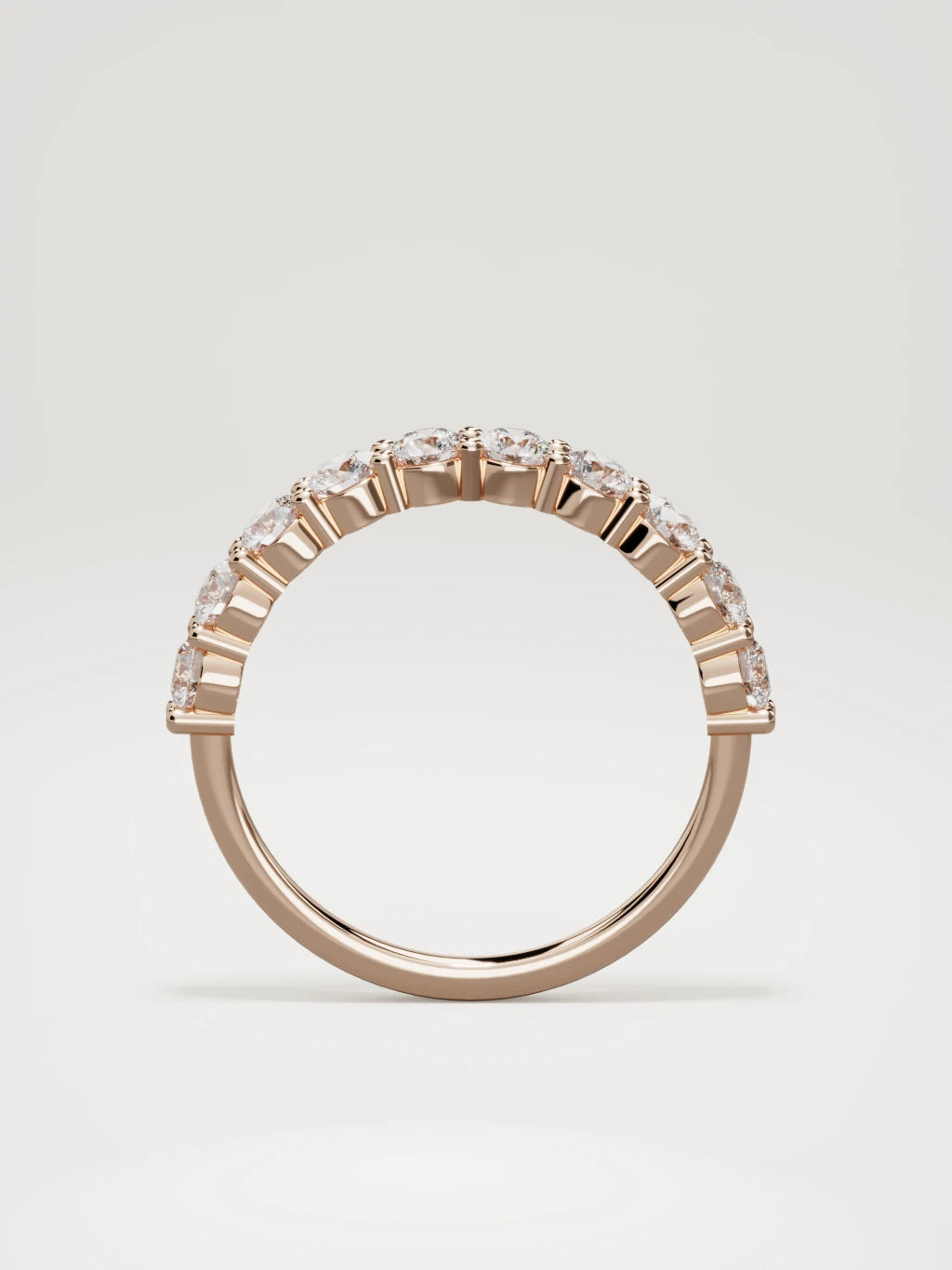 The Clara shared-prong half eternity band in 14K rose gold, standing front view