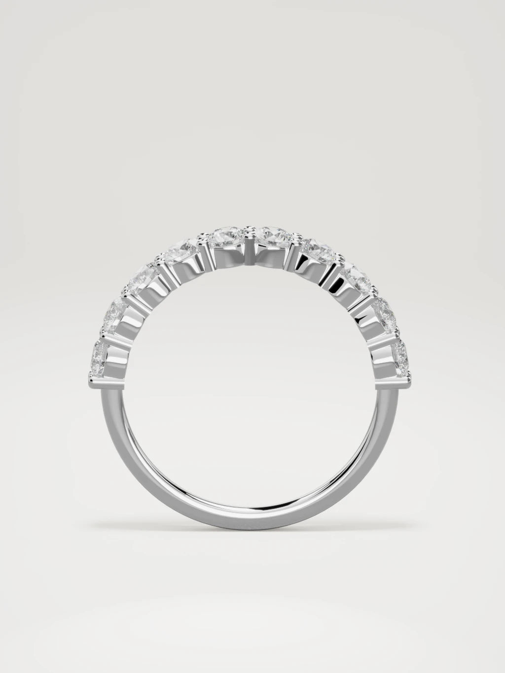 The Clara shared-prong half eternity band in 14K white gold, standing front view
