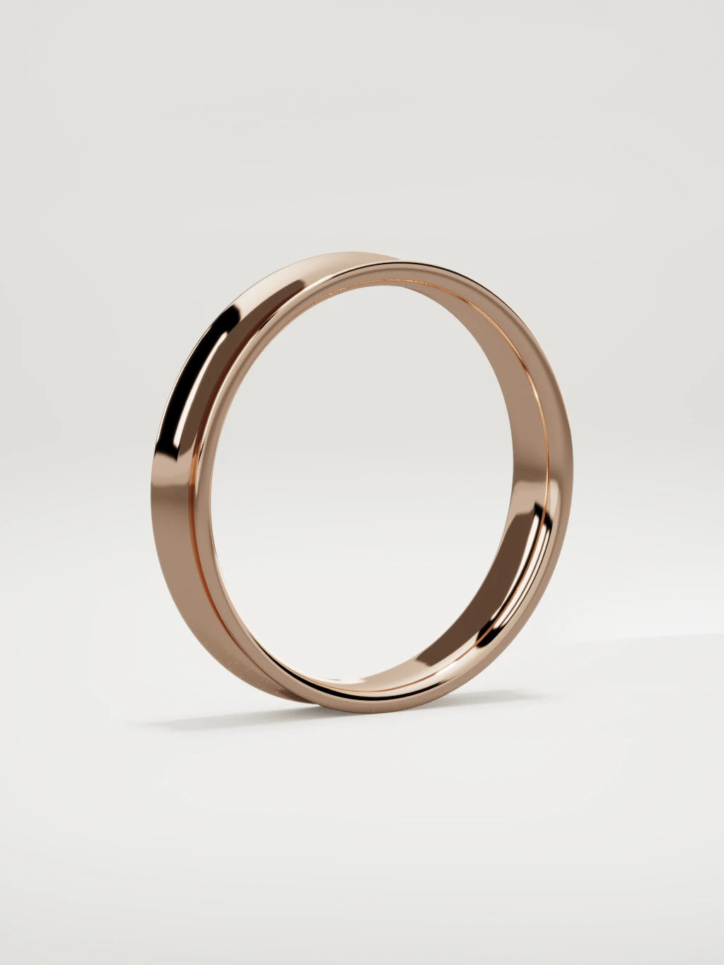 The Calma comfort-fit flat men's wedding band in 14K rose gold, 4 mm, standing three-quarter view