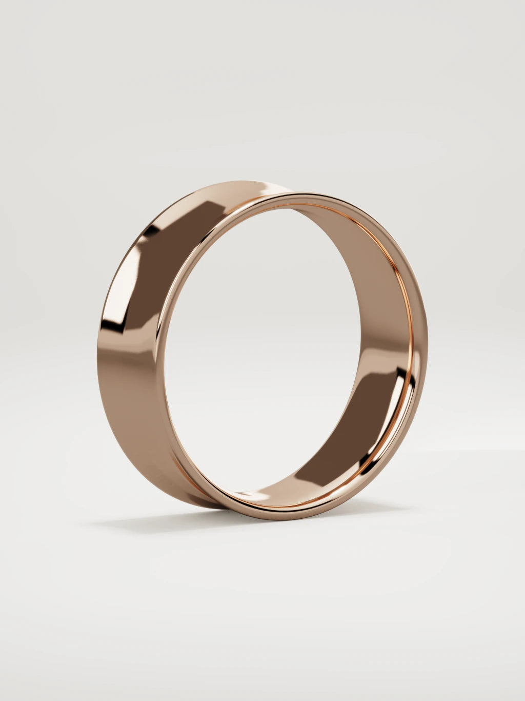 The Calma comfort-fit flat men's wedding band in 14K rose gold, 7 mm, standing three-quarter view