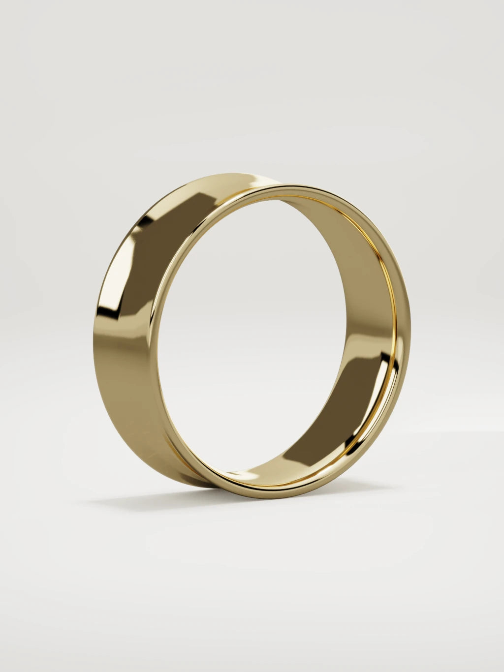The Calma comfort-fit flat men's wedding band in 14K yellow gold, 7 mm, standing three-quarter view