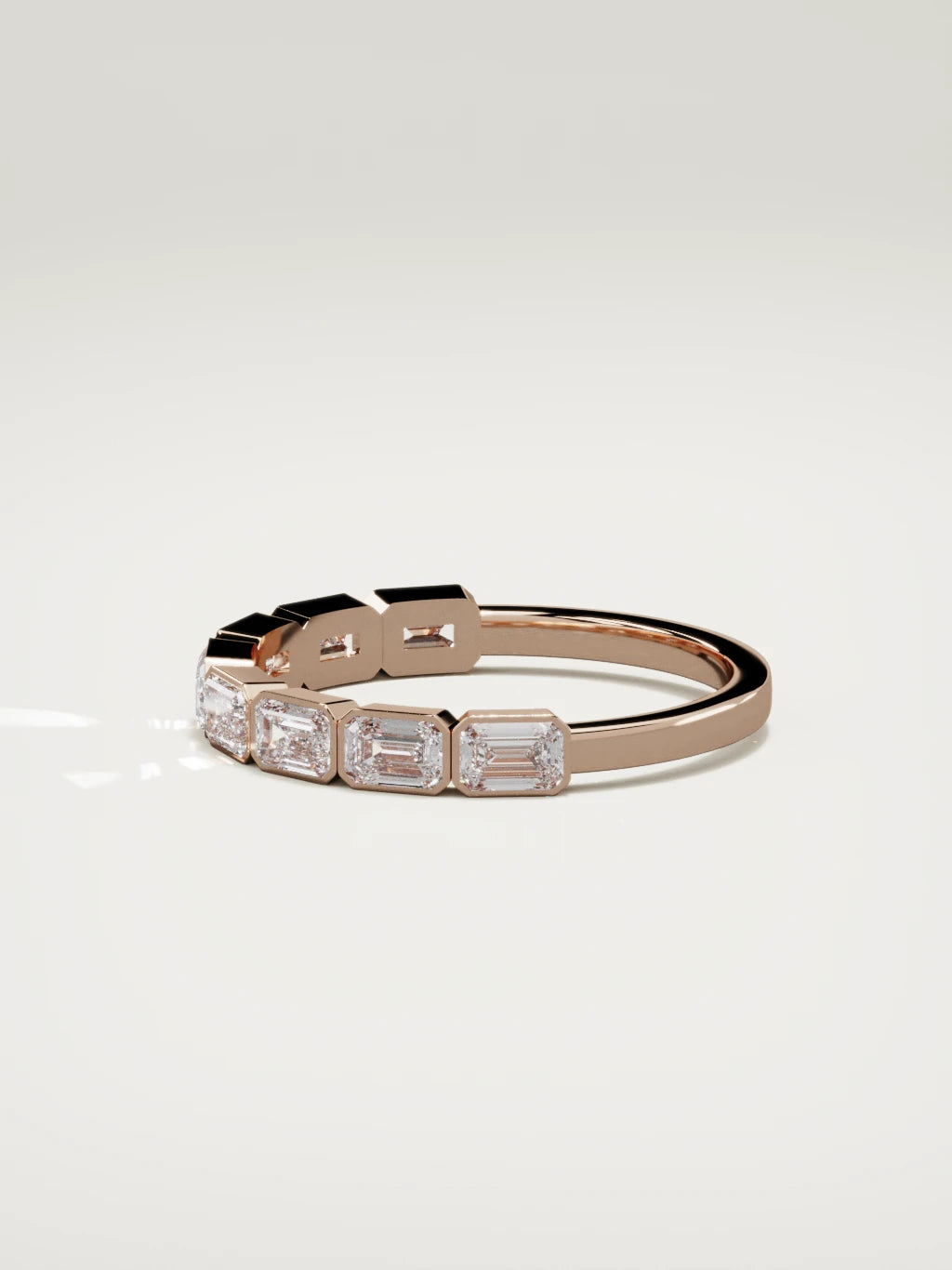 The Cristal east-west bezel emerald-cut band in 14K rose gold, side view