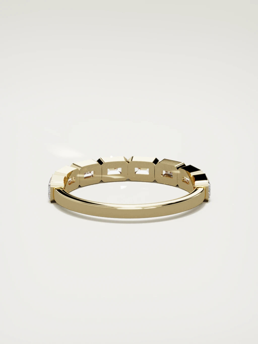 The Cristal east-west bezel emerald-cut band in 14K yellow gold, back view