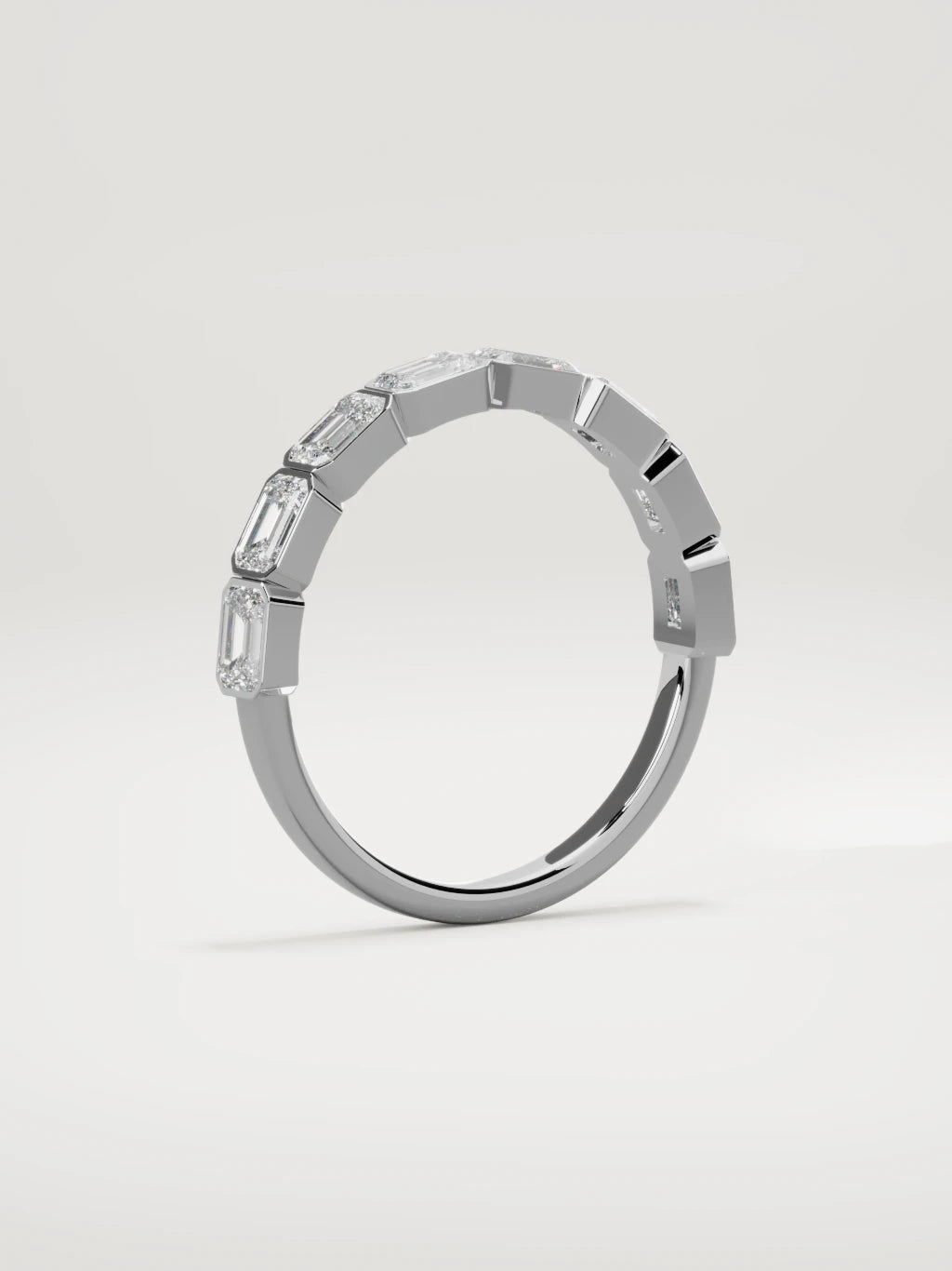 The Cristal east-west bezel emerald-cut band in 14K white gold, standing three-quarter view