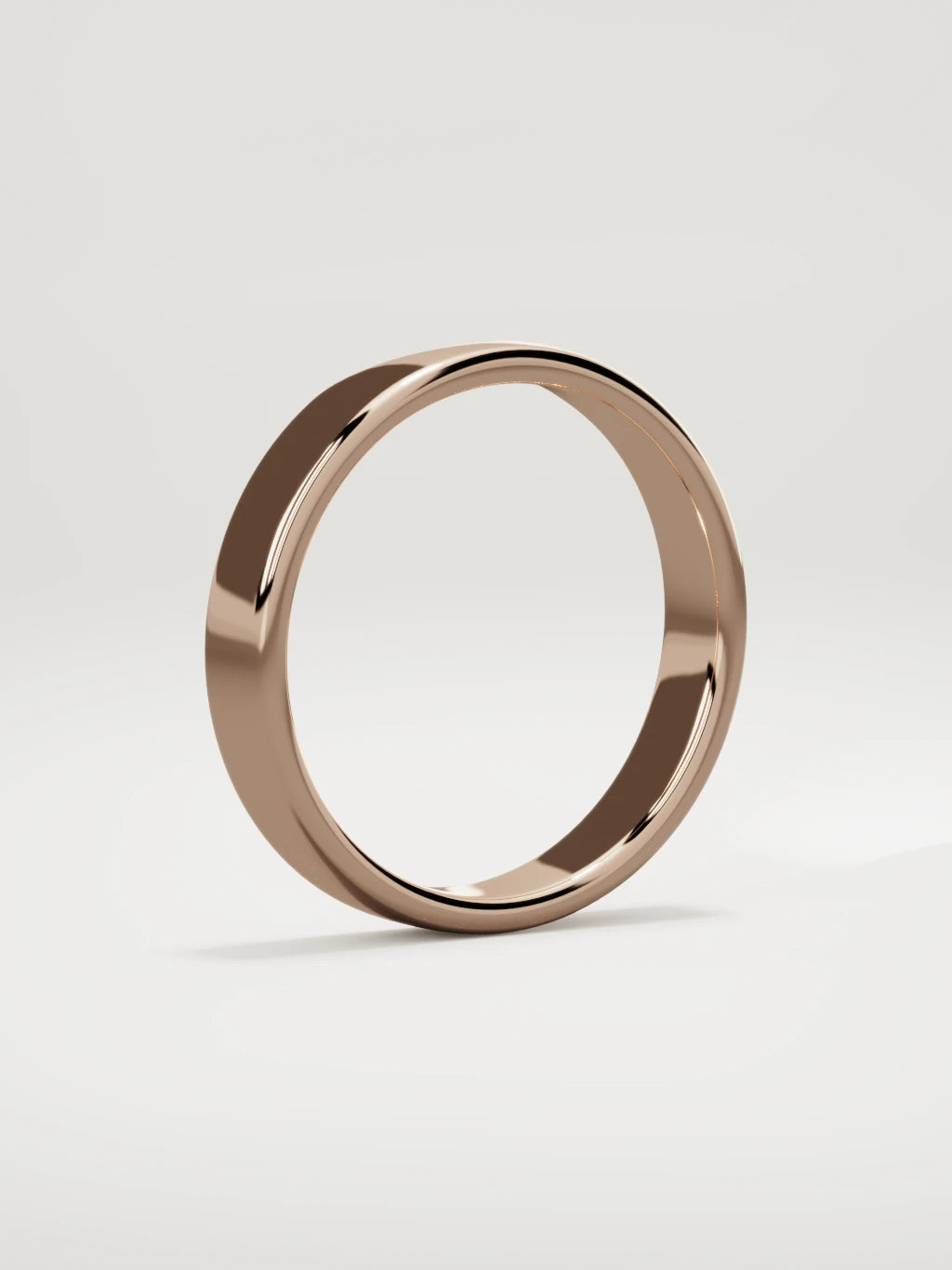 The Cuna wide notched contour wedding band in 14K rose gold, standing three-quarter view