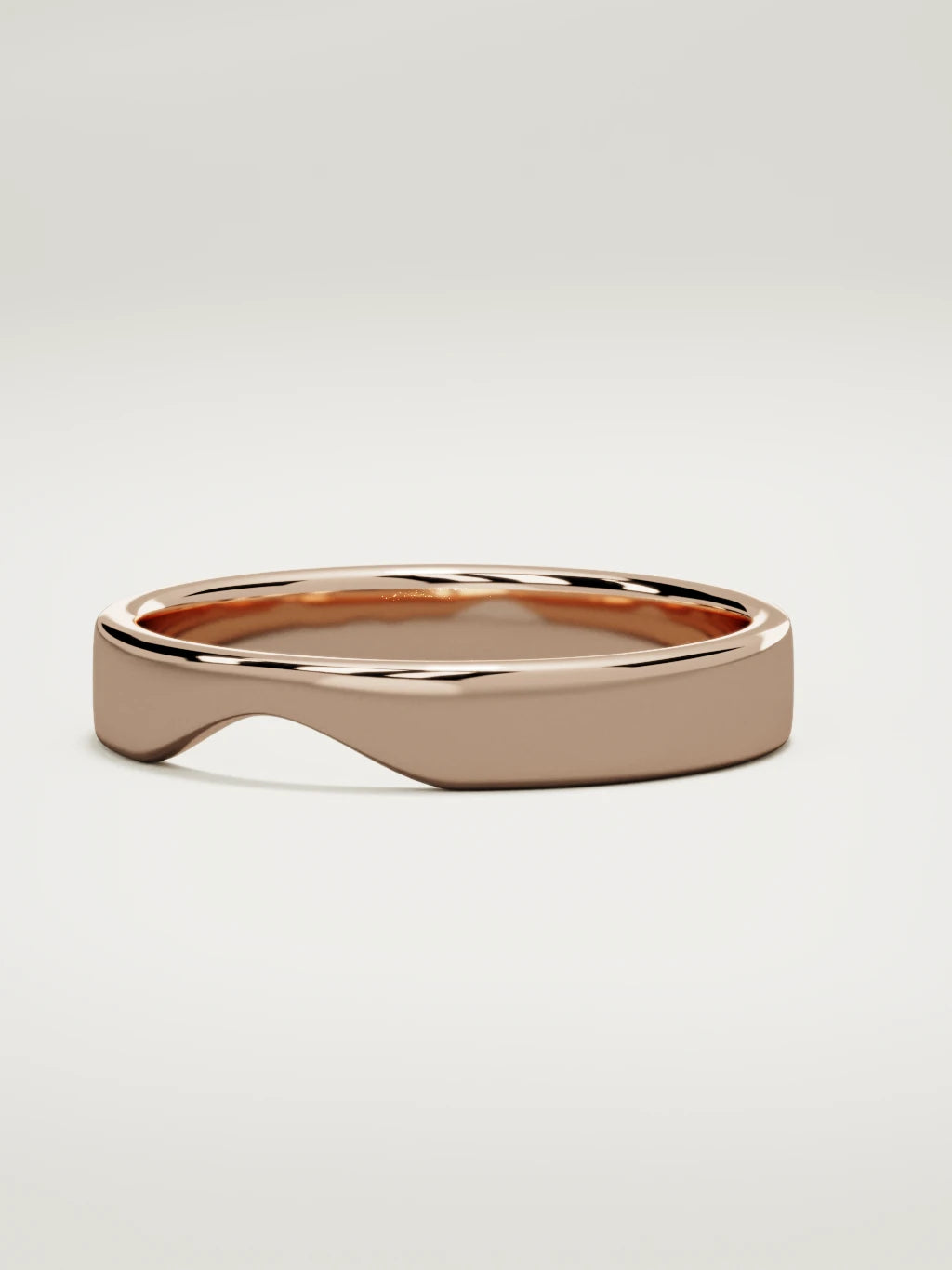 The Cuna wide notched contour wedding band in 14K rose gold, three-quarter view