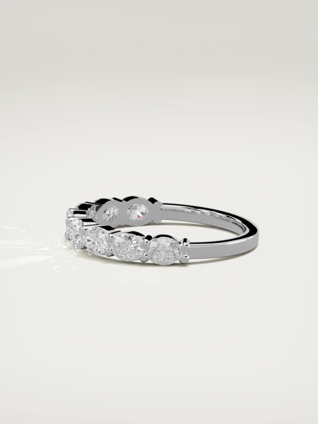 The Dama east-west oval half eternity band in 14K white gold, side view