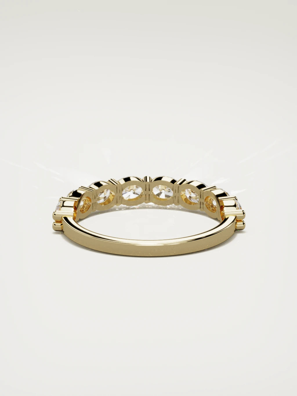 The Dama east-west oval half eternity band in 14K yellow gold, back view
