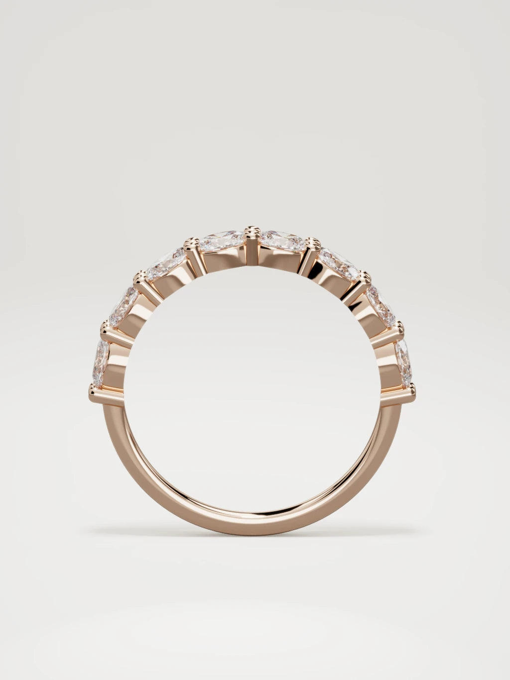 The Dama east-west oval half eternity band in 14K rose gold, standing front view