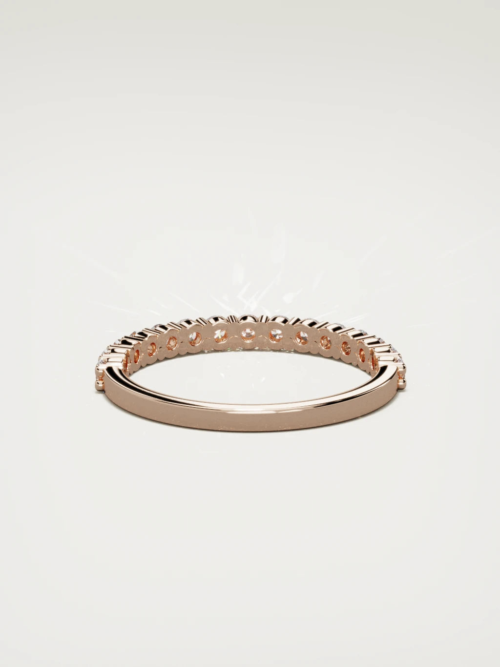 The Danza petite shared-prong half eternity band in 14K rose gold, back view