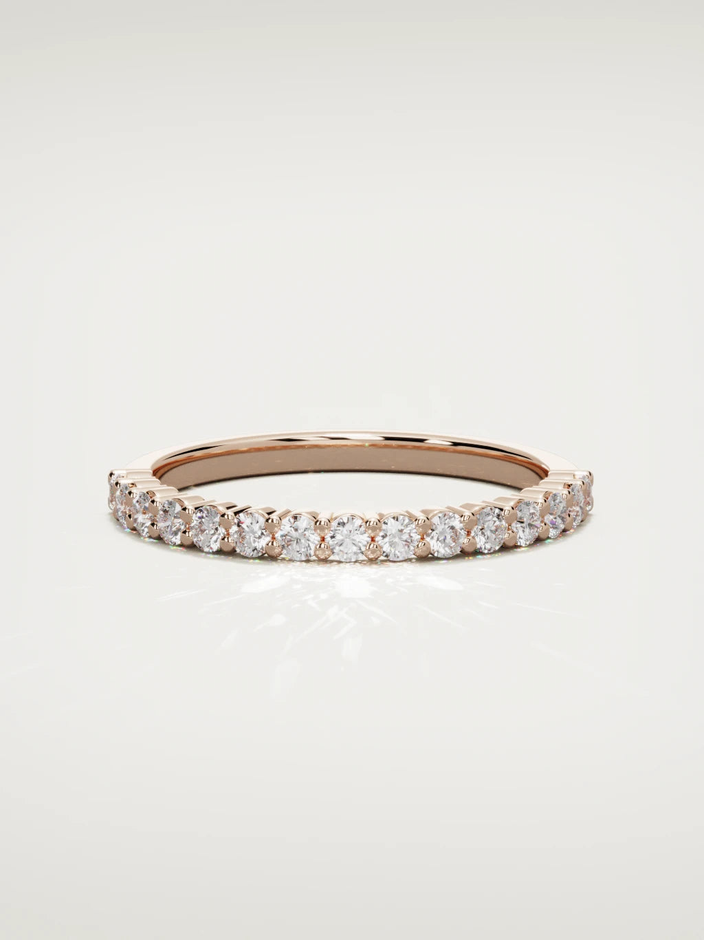 The Danza petite shared-prong half eternity band in 14K rose gold, front view