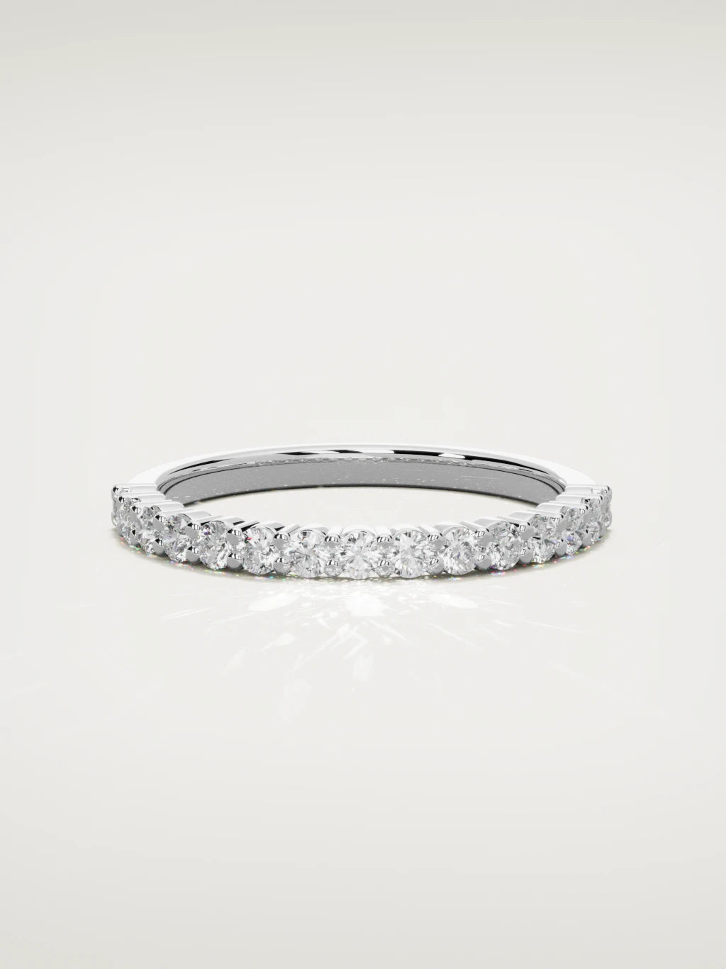 The Danza petite shared-prong half eternity band in 14K white gold, front view