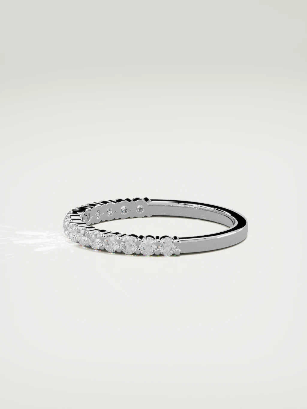 The Danza petite shared-prong half eternity band in 14K white gold, side view