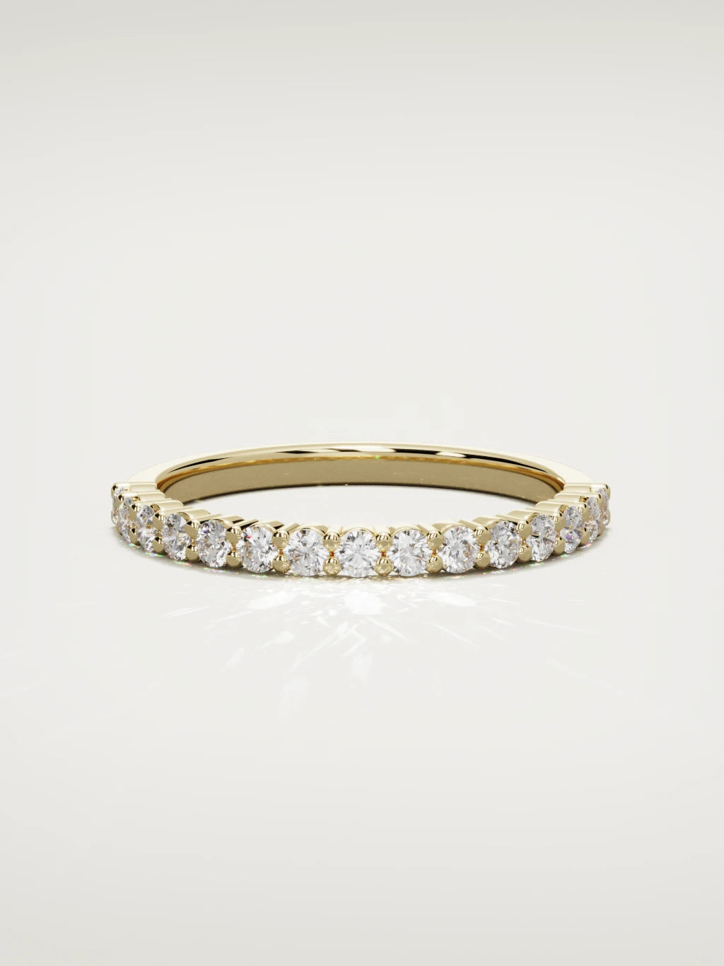 The Danza petite shared-prong half eternity band in 14K yellow gold, front view