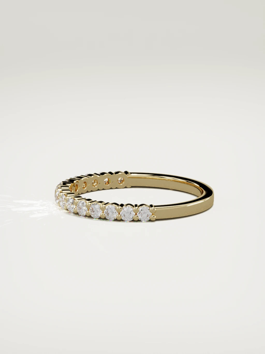 The Danza petite shared-prong half eternity band in 14K yellow gold, side view