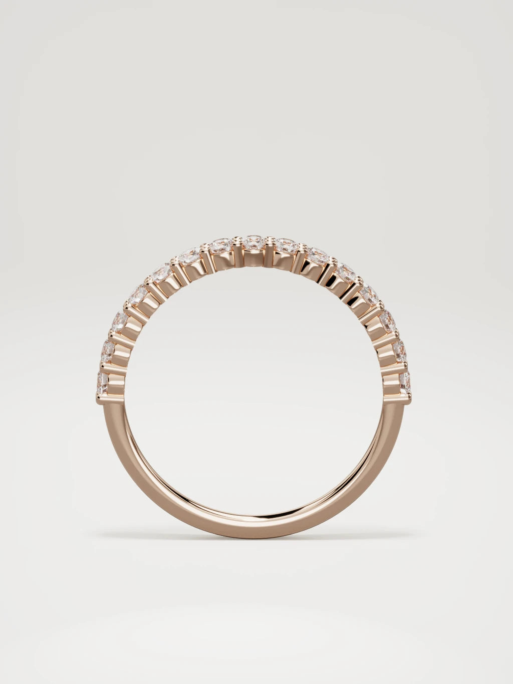 The Danza petite shared-prong half eternity band in 14K rose gold, standing front view