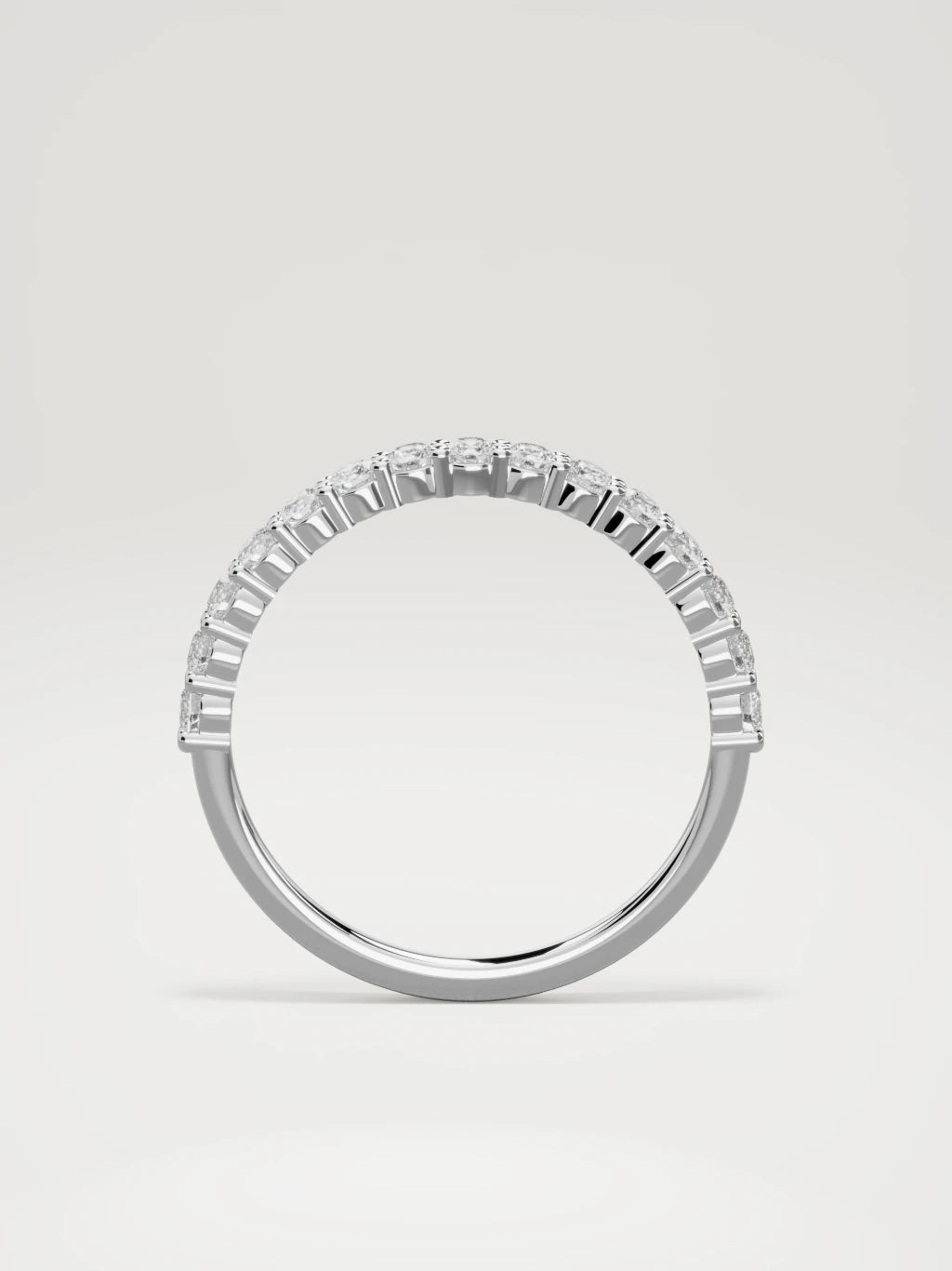 The Danza petite shared-prong half eternity band in 14K white gold, standing front view