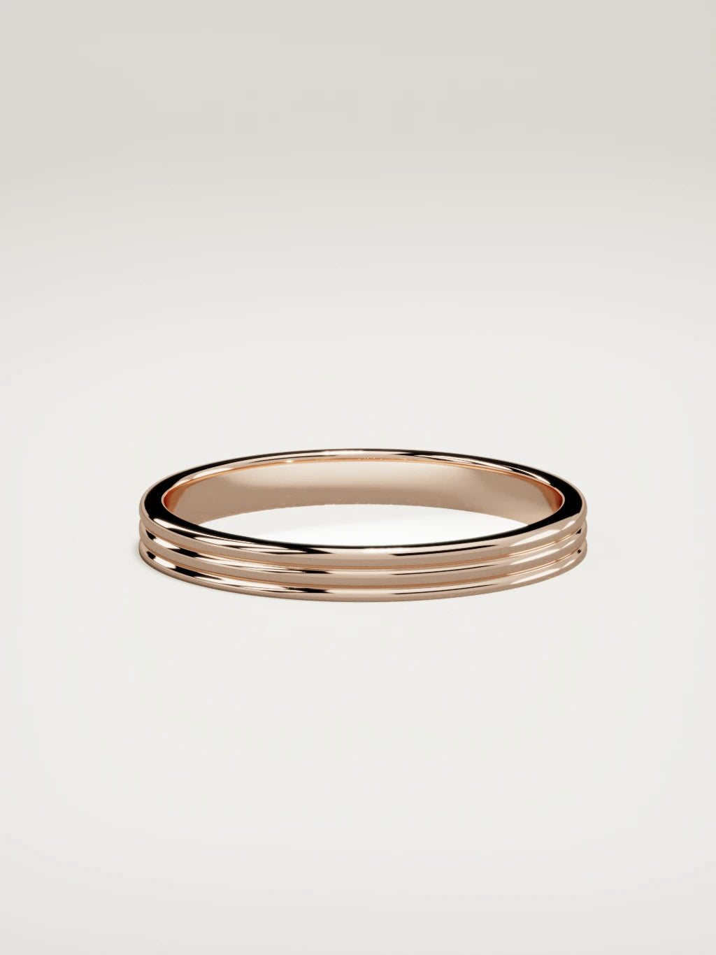 The Doble double-groove men's wedding band in 14K rose gold, 3 mm, side view