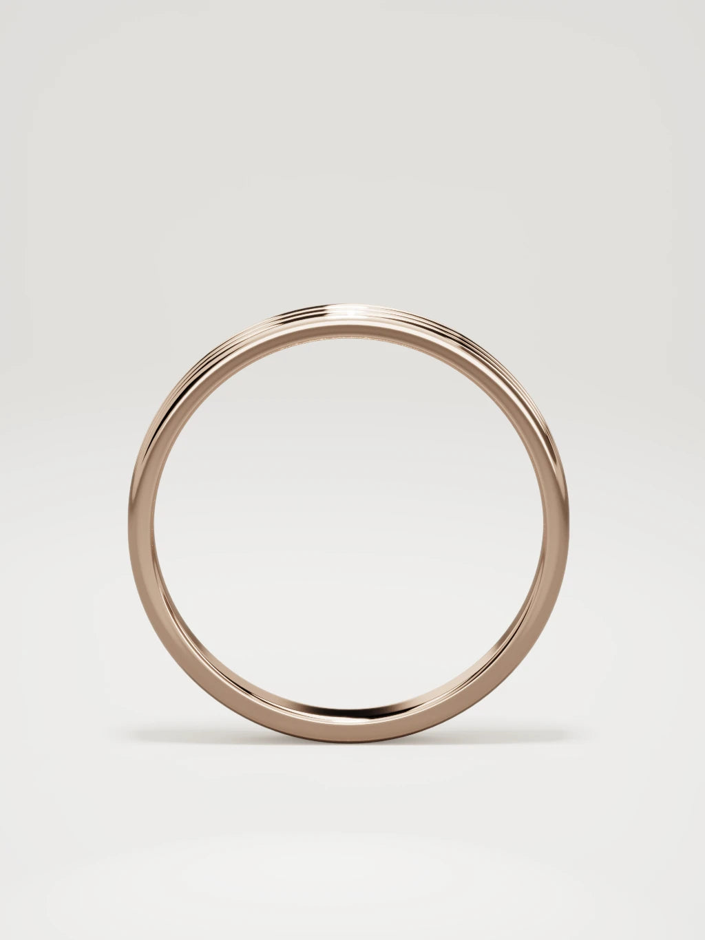 The Doble double-groove men's wedding band in 14K rose gold, 3 mm, standing front view