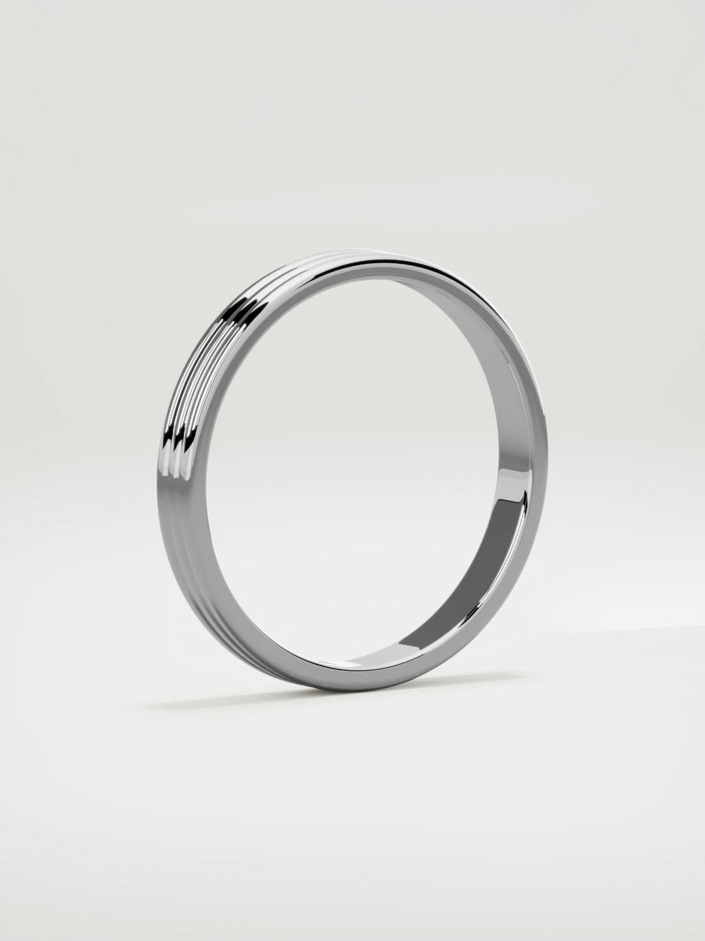 The Doble double-groove men's wedding band in 14K white gold, 3 mm, standing three-quarter view