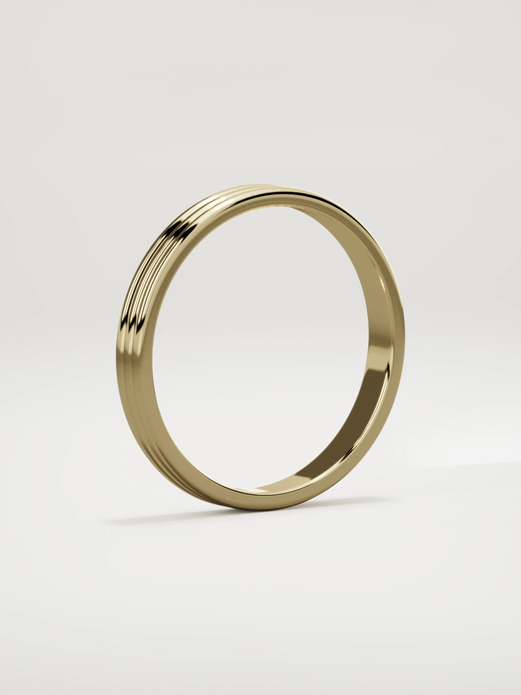 The Doble double-groove men's wedding band in 14K yellow gold, 3 mm, standing three-quarter view
