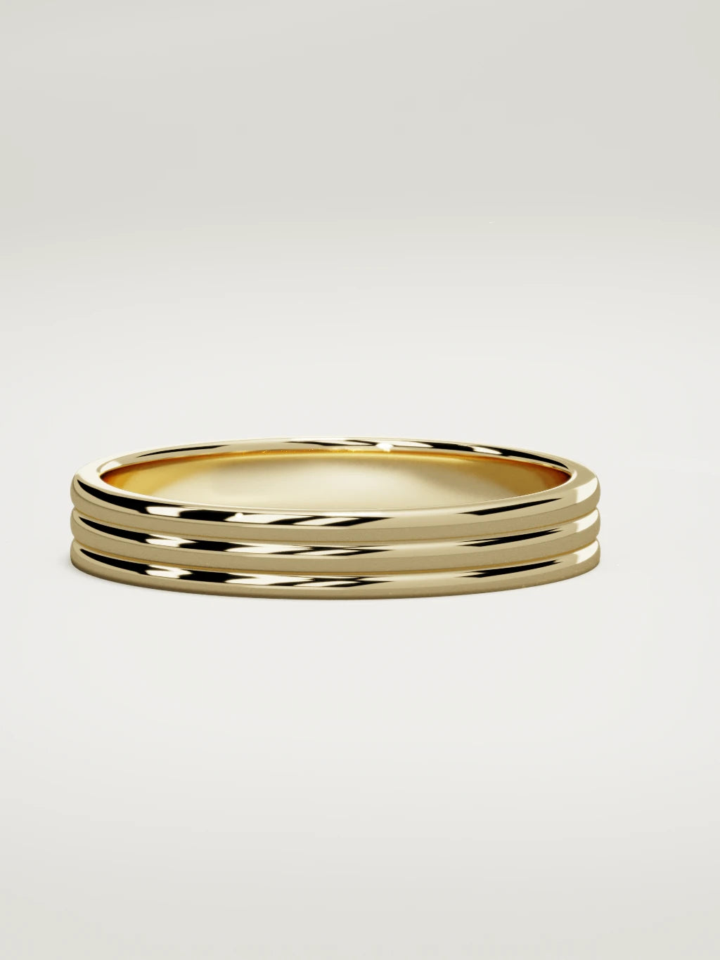 The Doble double-groove men's wedding band in 14K yellow gold, 4 mm, three-quarter view