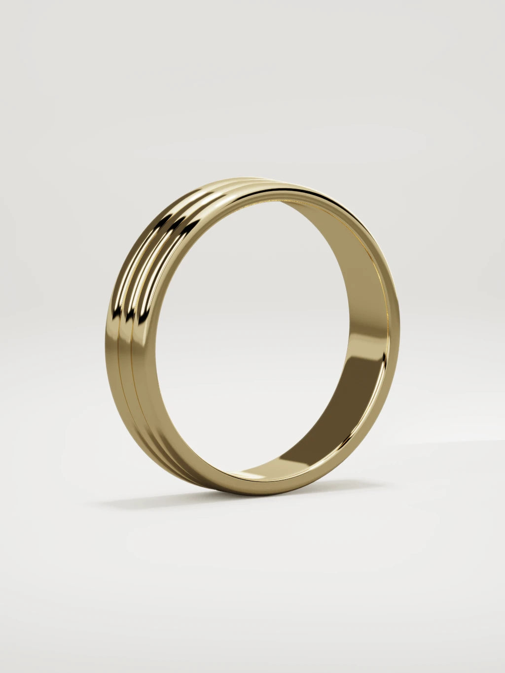 The Doble double-groove men's wedding band in 14K yellow gold, 5 mm, standing three-quarter view