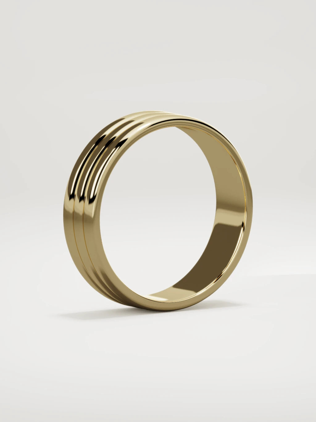 The Doble double-groove men's wedding band in 14K yellow gold, 6 mm, standing three-quarter view
