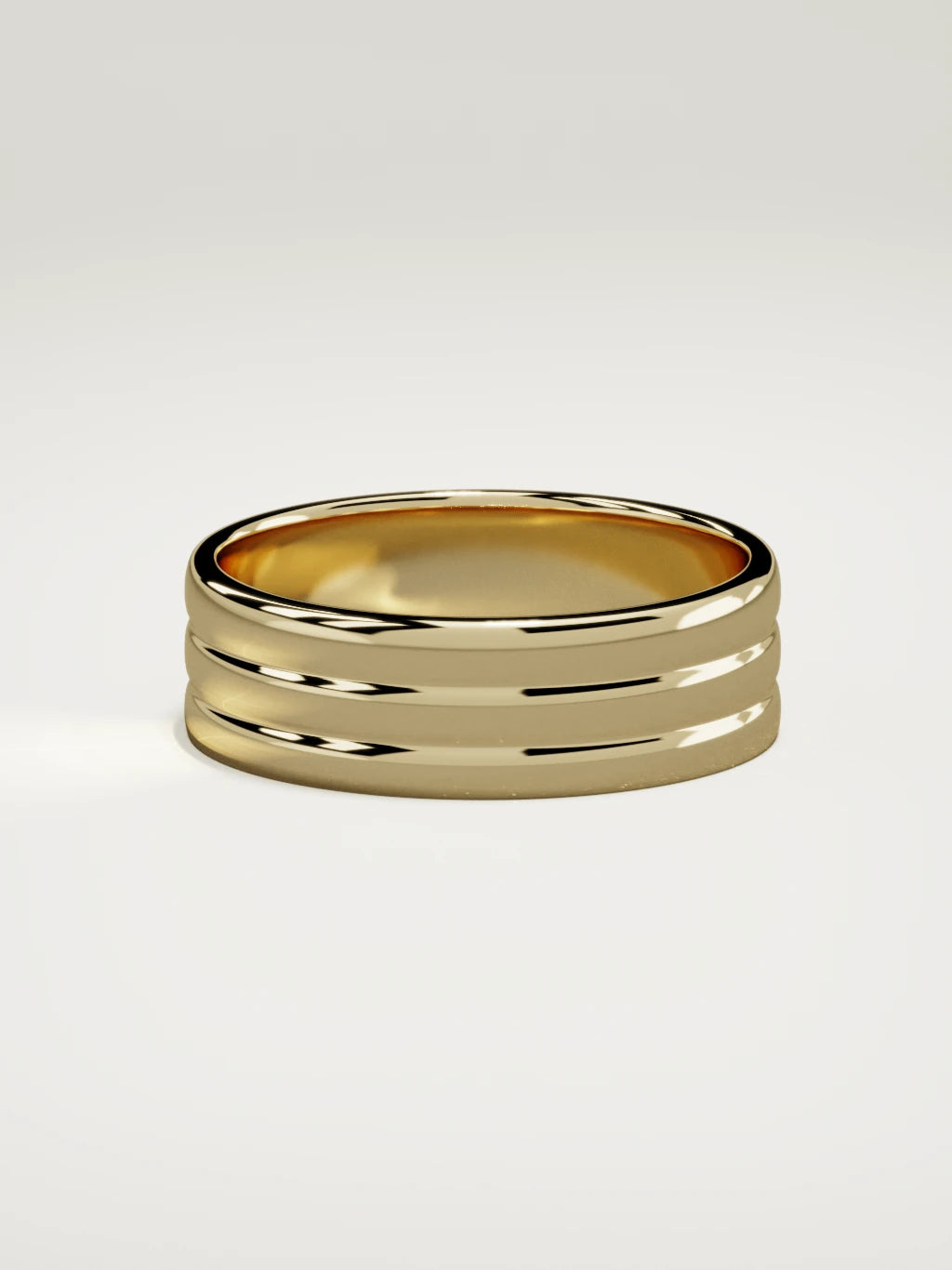The Doble double-groove men's wedding band in 14K yellow gold, 7 mm, side view
