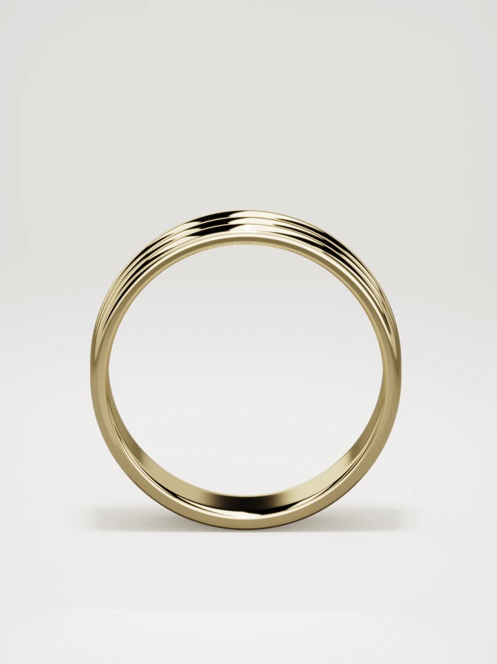 The Doble double-groove men's wedding band in 14K yellow gold, 7 mm, standing front view
