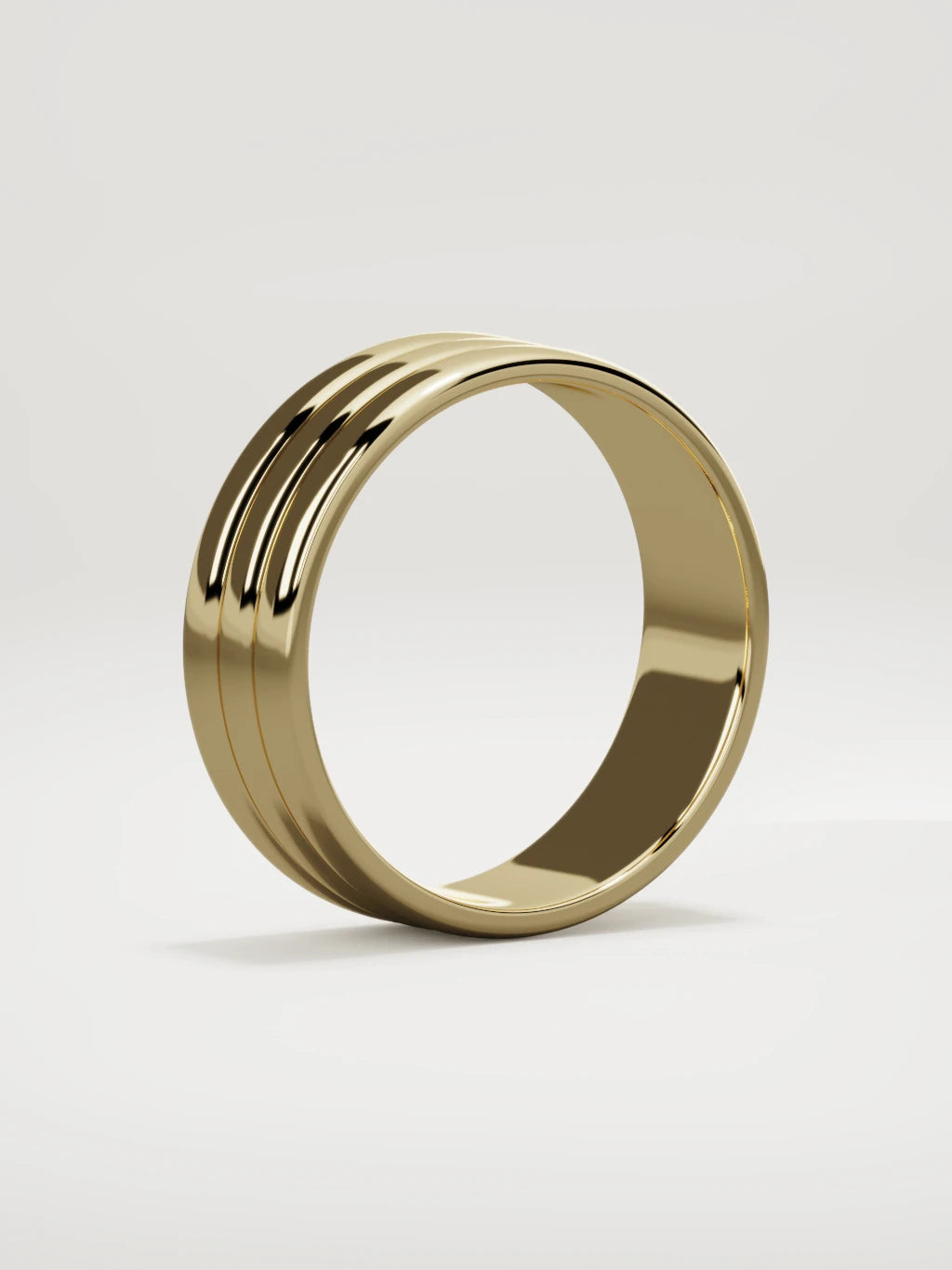The Doble double-groove men's wedding band in 14K yellow gold, 7 mm, standing three-quarter view