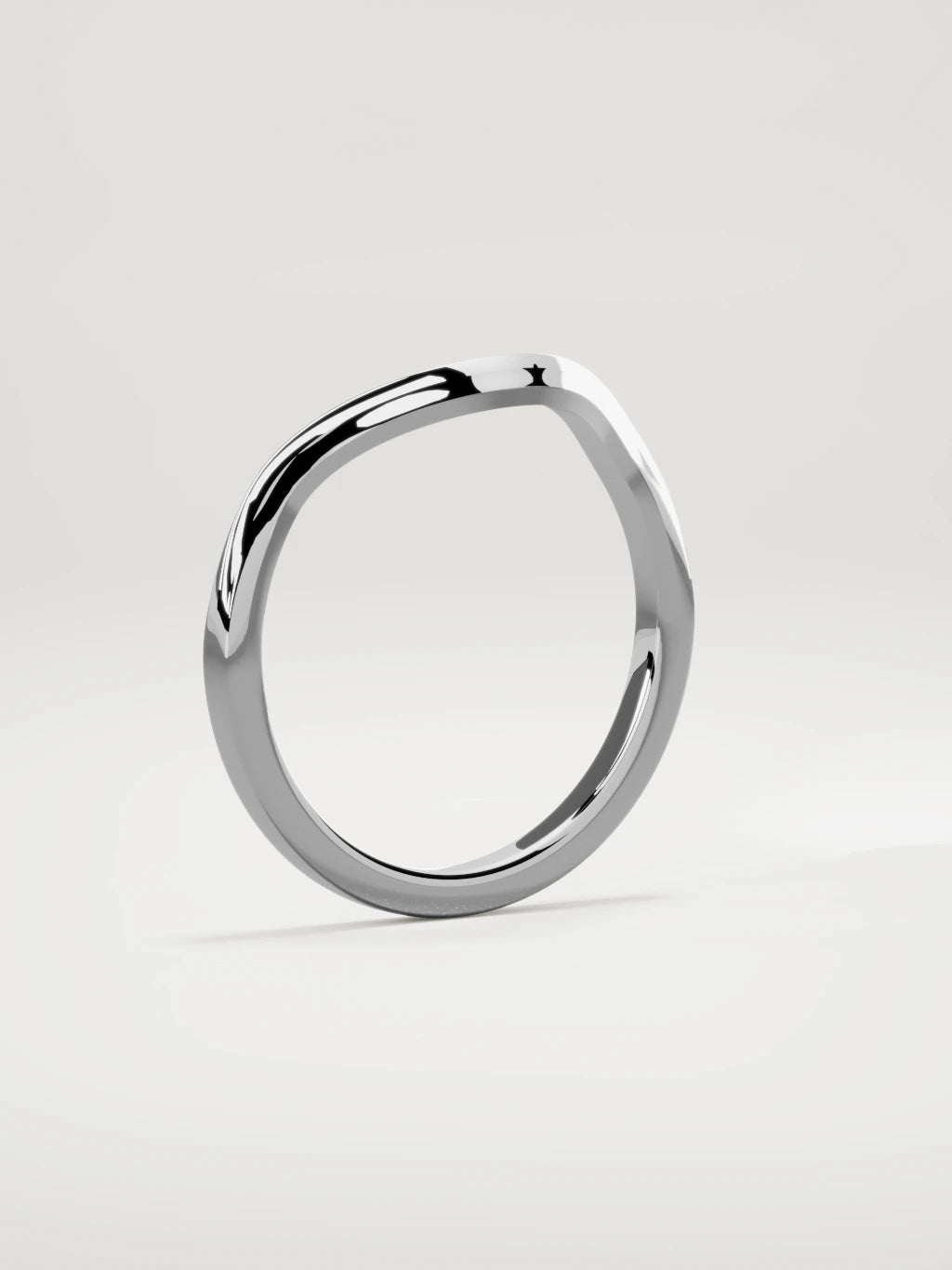The Eco contour wedding band in 14K white gold, standing three-quarter view