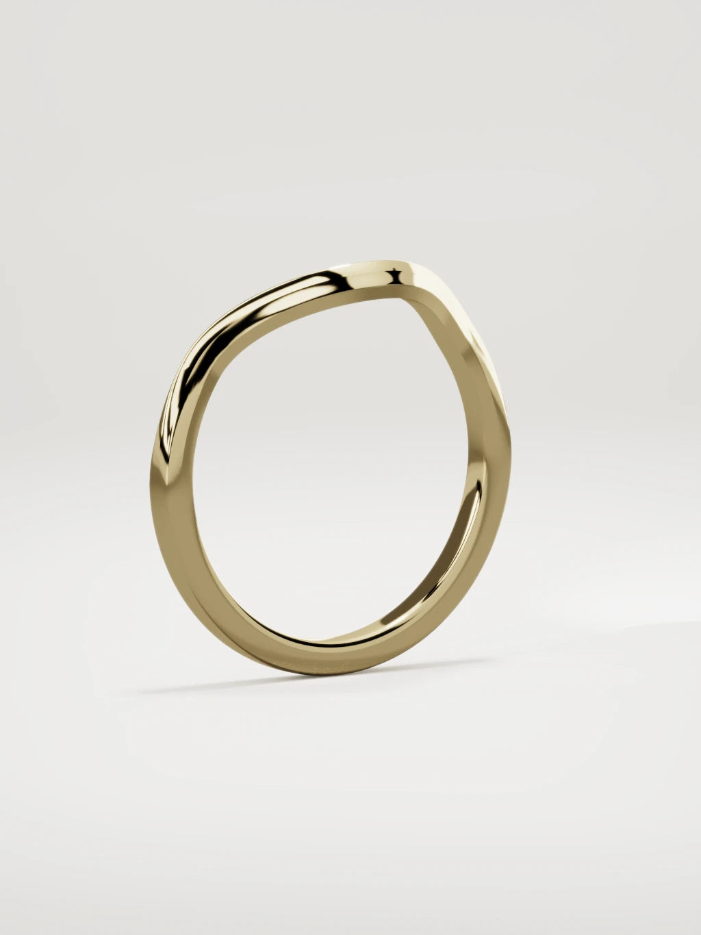 The Eco contour wedding band in 14K yellow gold, standing three-quarter view