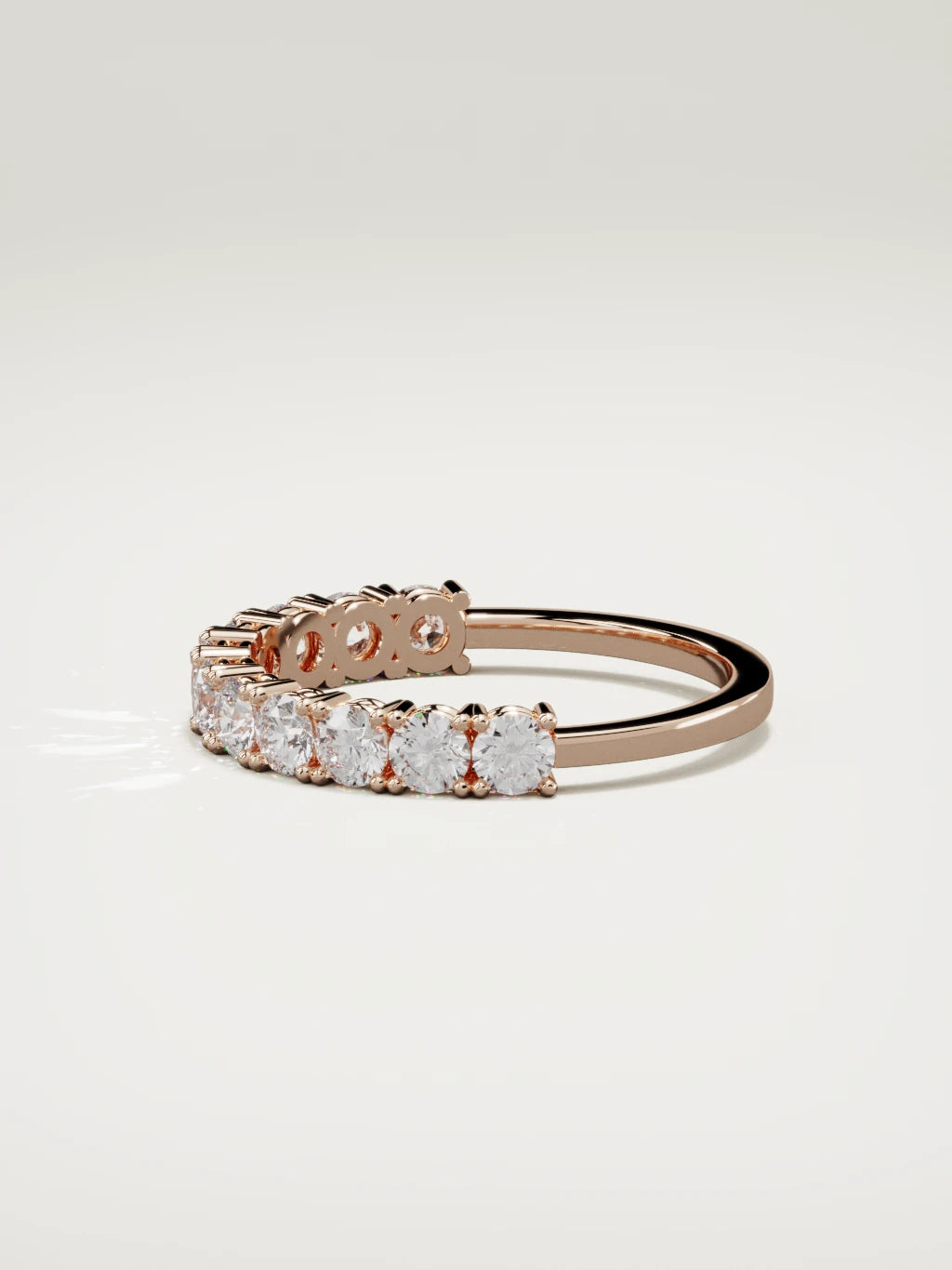 The Gloria open-prong half eternity band in 14K rose gold, side view