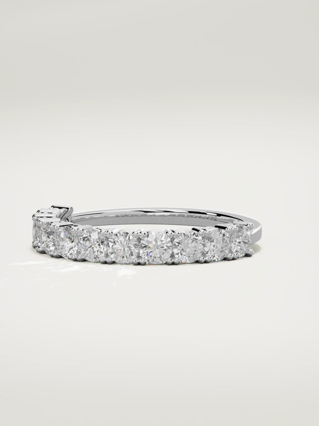 The Gloria open-prong half eternity band in 14K white gold, three-quarter view