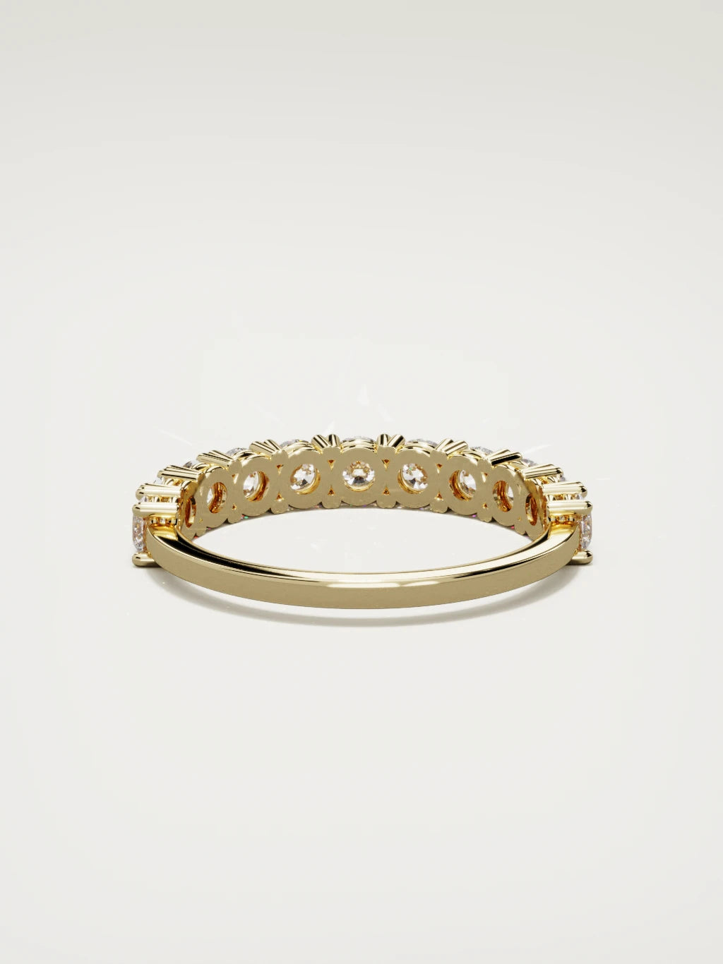 The Gloria open-prong half eternity band in 14K yellow gold, back view