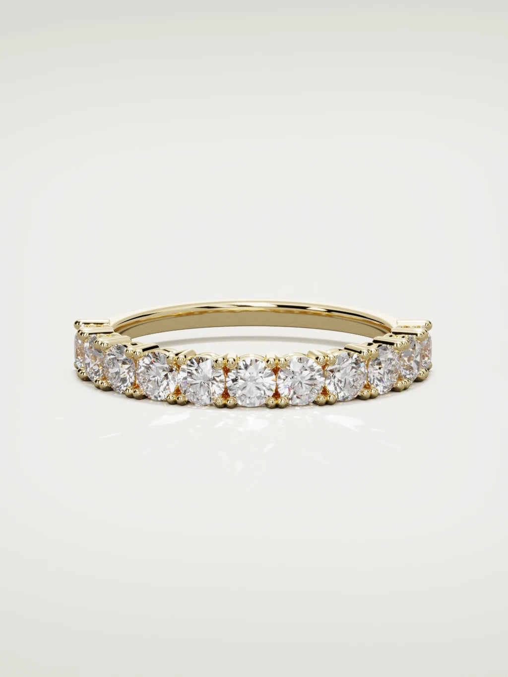 The Gloria open-prong half eternity band in 14K yellow gold, front view