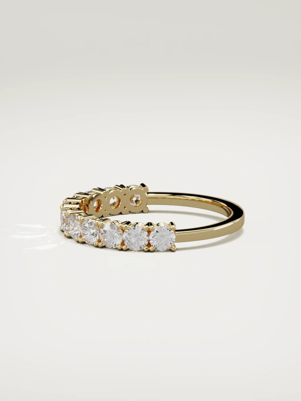 The Gloria open-prong half eternity band in 14K yellow gold, side view